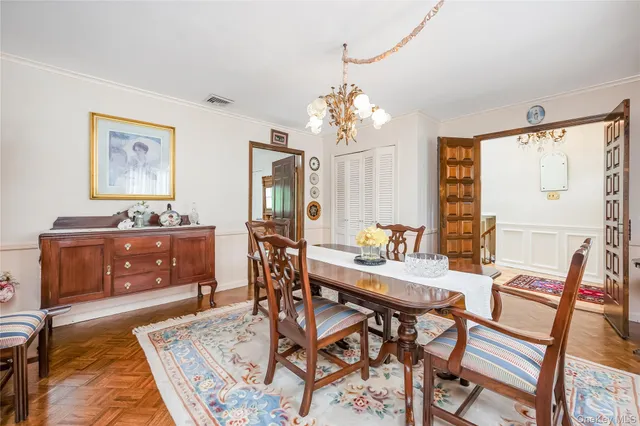 a view of a dining room with furniture and window