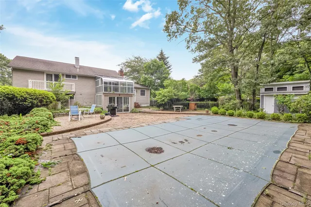 a view of a yard with large trees