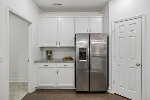 a kitchen with cabinets and stainless steel appliances