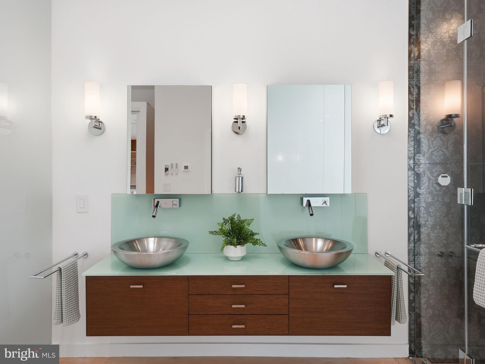 1845 Calvert Street Northwest Washington, DC 20009 - Photo 24 of 48 a bathroom with a sink and a mirror