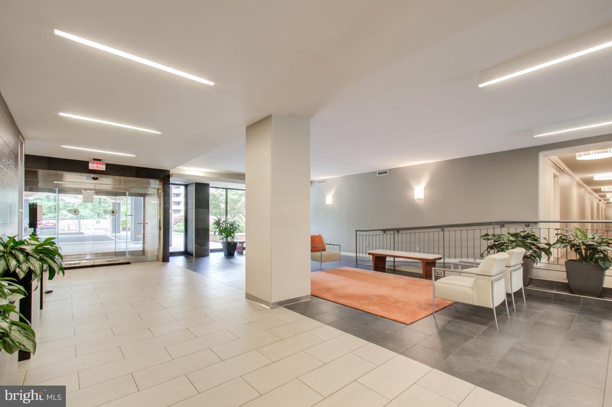 2939 Van Ness Street Northwest, Unit 737 Washington, DC 20008 - Photo 17 of 18 a lobby with furniture and a large window