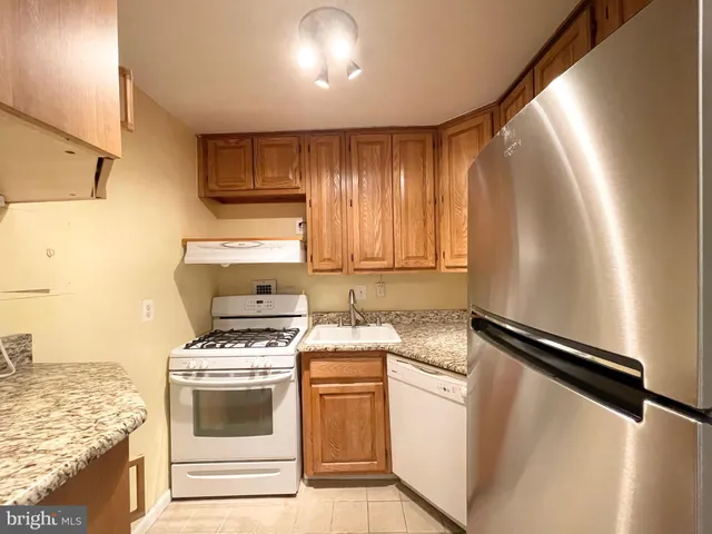 a kitchen with a stove and a microwave