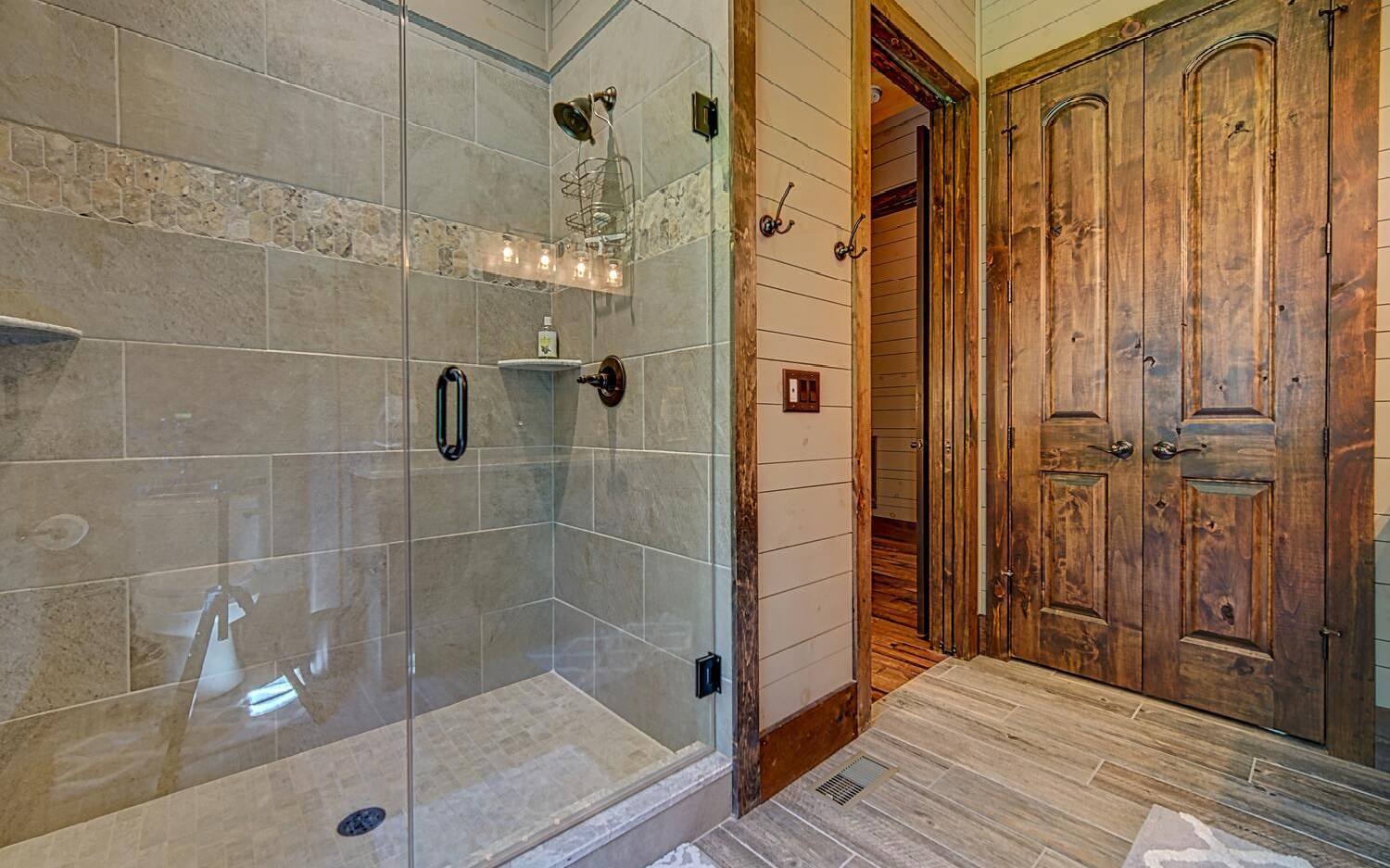 783 Eaton Road Blue Ridge, GA 30513 - Photo 38 of 64 a bathroom with a shower