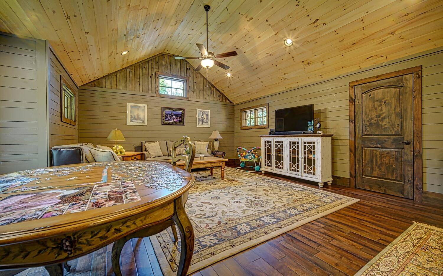 783 Eaton Road Blue Ridge, GA 30513 - Photo 54 of 64 a living room with furniture and a flat screen tv
