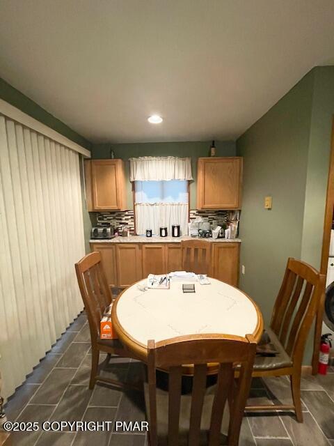 1450 Deer Run East Bushkill, PA 18324 - Photo 13 of 24 a kitchen with a dining table chairs and refrigerator