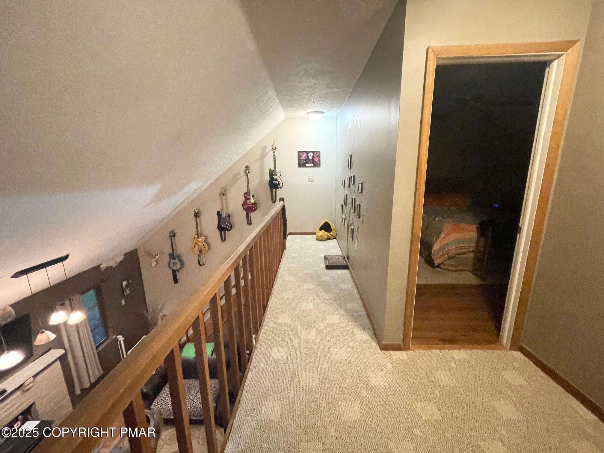 1450 Deer Run East Bushkill, PA 18324 - Photo 21 of 24 a view of hallway with stairs and wooden floor