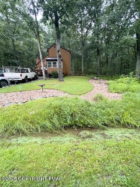 1450 Deer Run East Bushkill, PA 18324 - Photo 3 of 24 a house view with a garden space