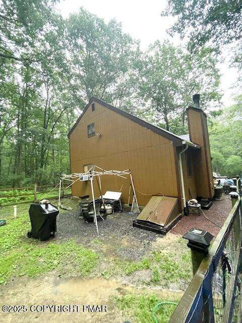 1450 Deer Run East Bushkill, PA 18324 - Photo 9 of 24 a backyard of a house with outdoor seating