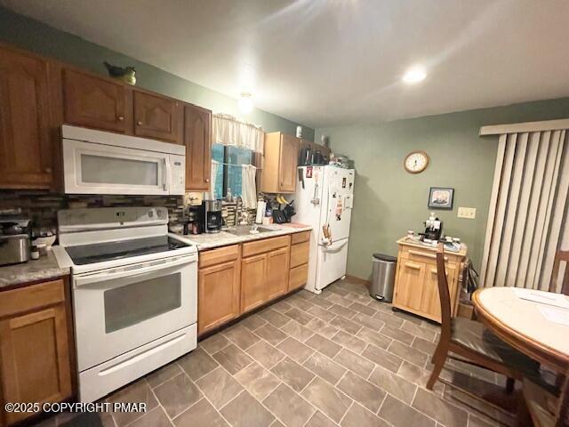 1450 Deer Run East Bushkill, PA 18324 - Photo 10 of 24 a kitchen with a stove a sink and a microwave