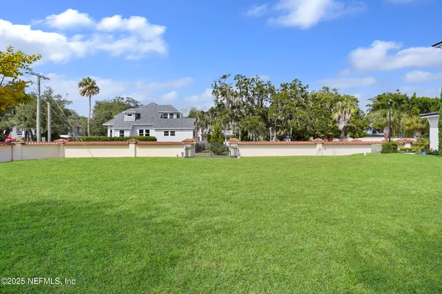 a view of a park with large trees
