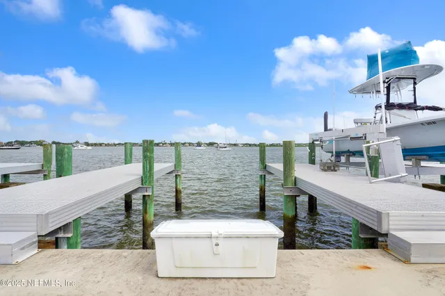 a view of roof deck with a barbeque and seating space