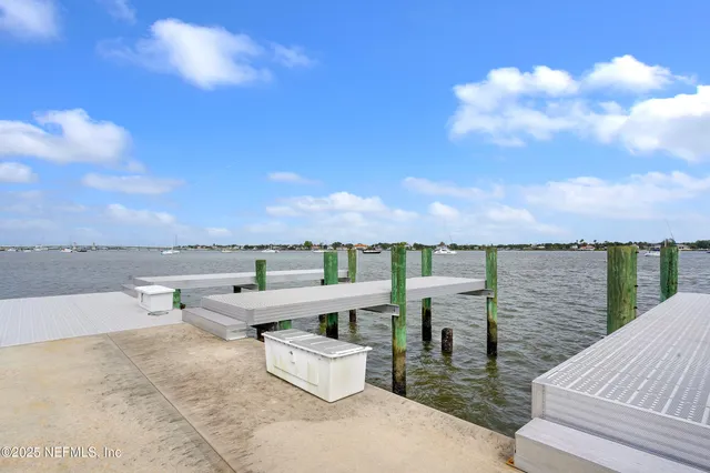 a view of a terrace with wooden floor and lake view