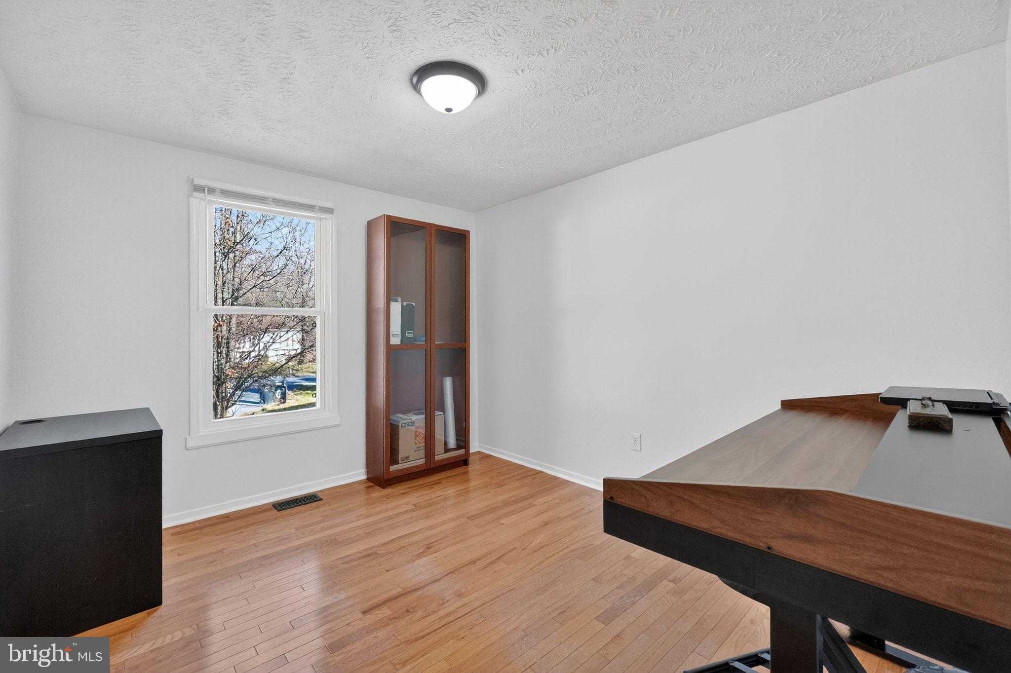 12608 Carland Place Laurel, MD 20708 - Photo 14 of 38 a view of a workspace with furniture and window