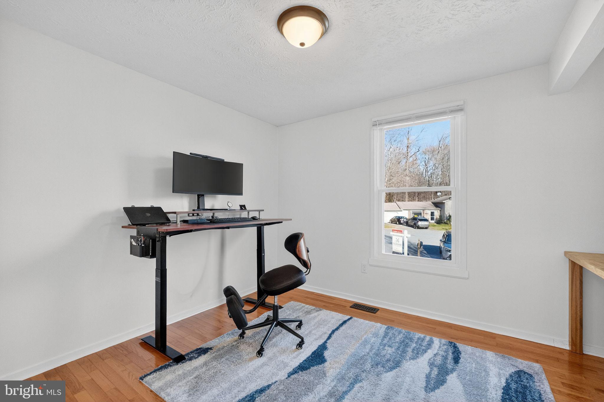 12608 Carland Place Laurel, MD 20708 - Photo 16 of 38 a view of a workspace with furniture and a window
