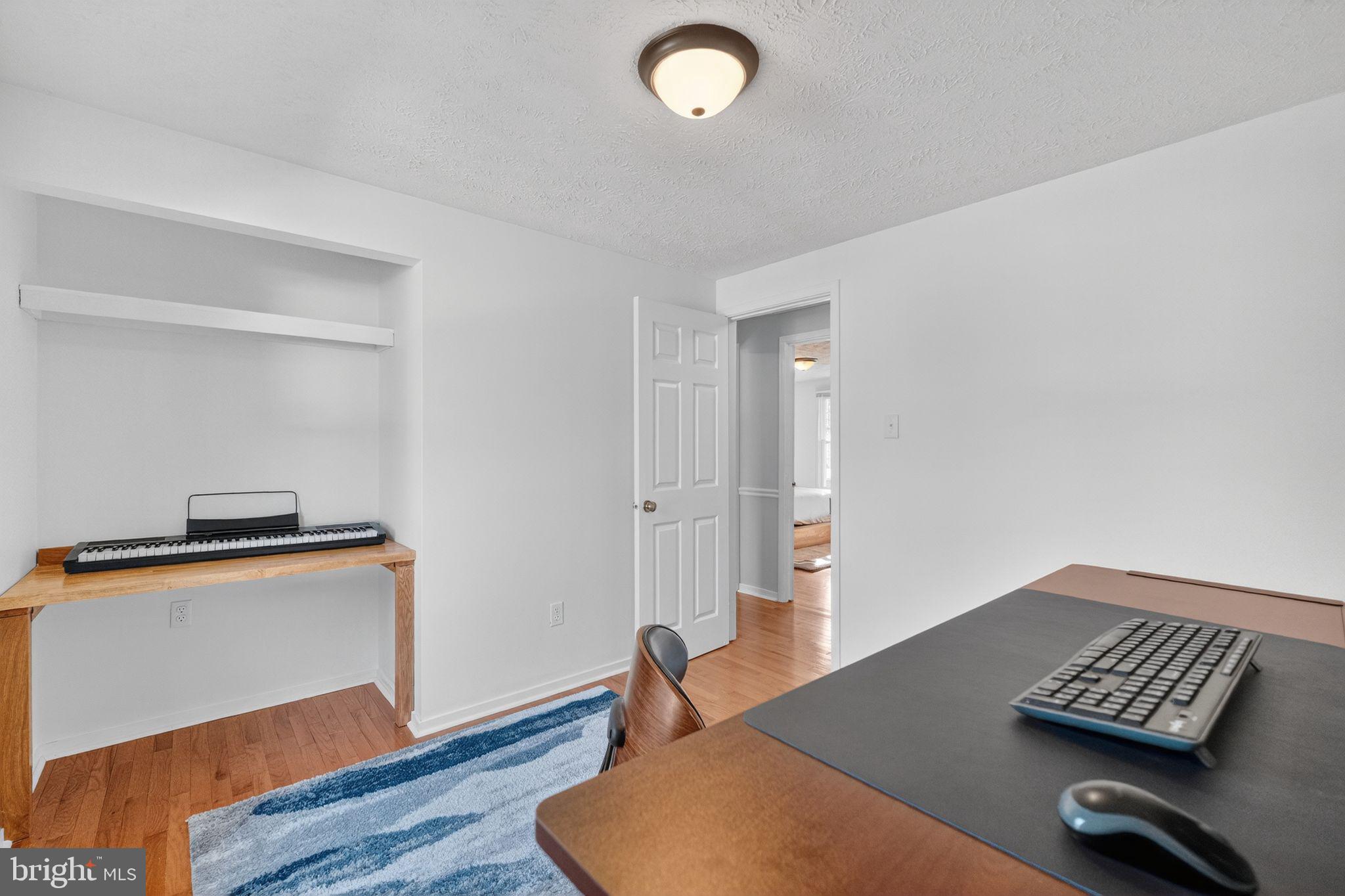 12608 Carland Place Laurel, MD 20708 - Photo 17 of 38 a workspace with furniture and window