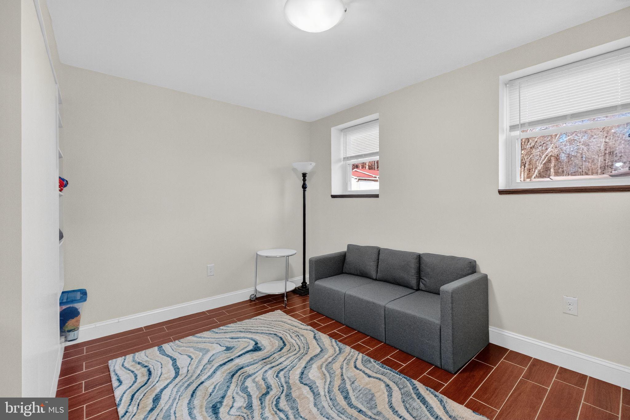 12608 Carland Place Laurel, MD 20708 - Photo 19 of 38 a bedroom with furniture and a couch