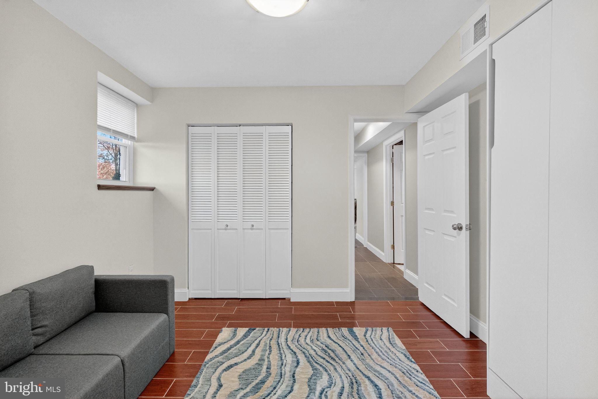 12608 Carland Place Laurel, MD 20708 - Photo 20 of 38 a living room with furniture and a rug