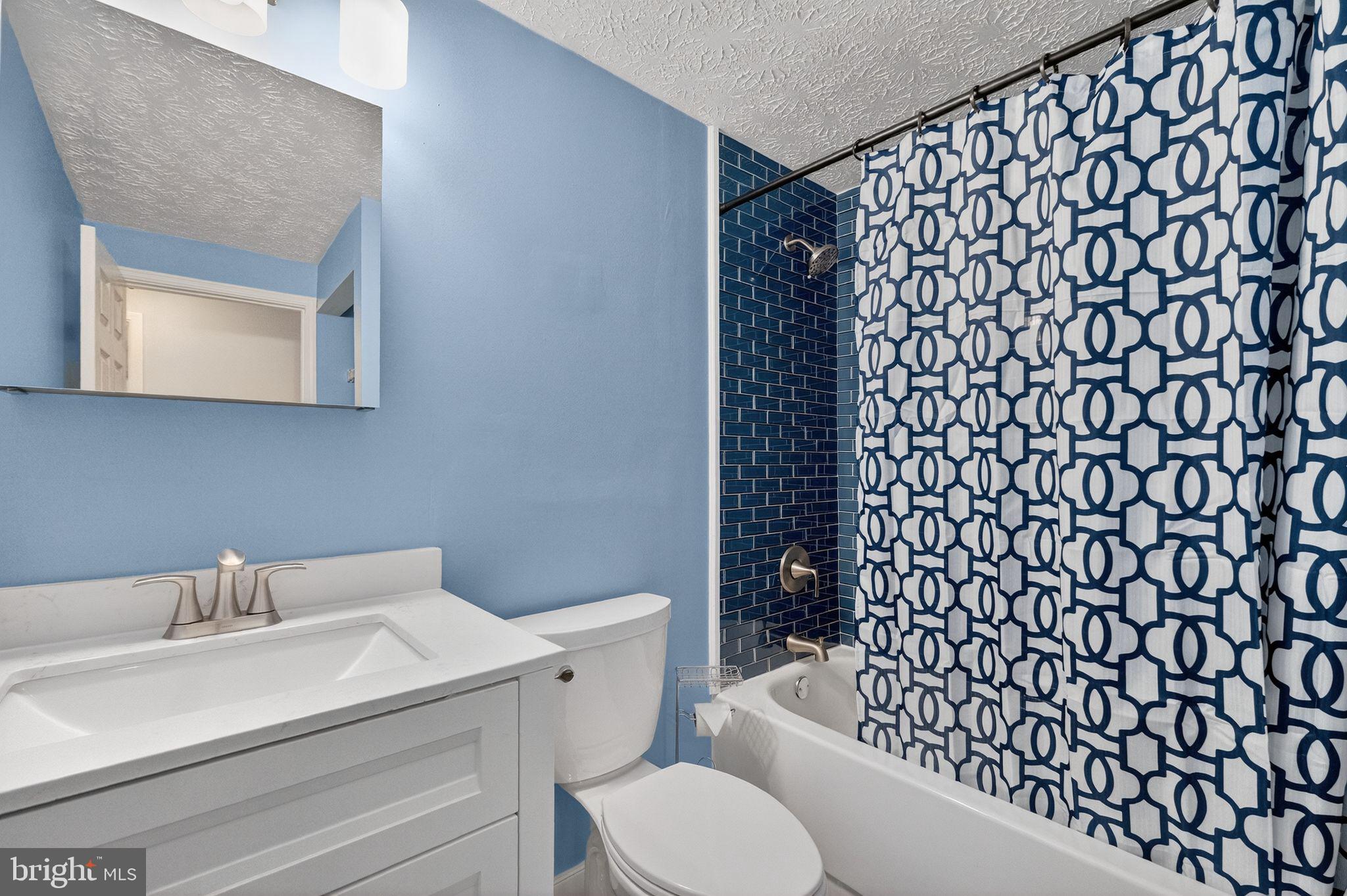 12608 Carland Place Laurel, MD 20708 - Photo 9 of 38 a bathroom with a sink and a toilet