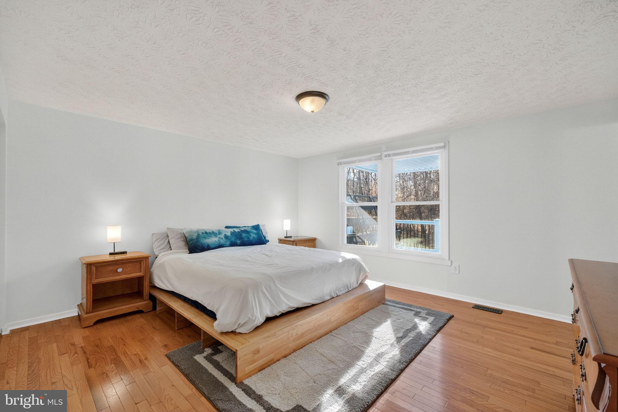 12608 Carland Place Laurel, MD 20708 - Photo 10 of 38 a bedroom with a bed and a window