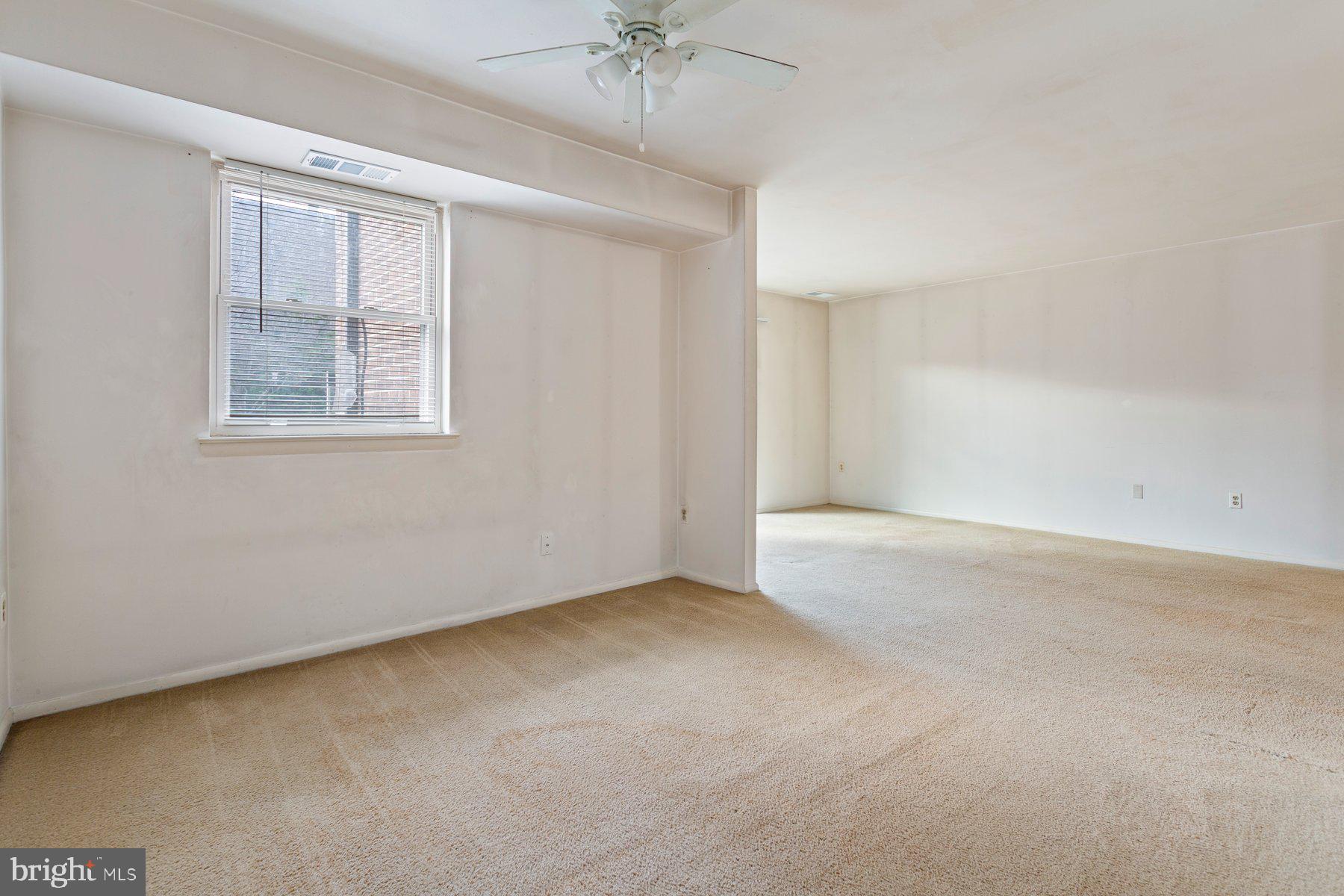2305 Greenery Lane, Unit T43 Silver Spring, MD 20906 - Photo 14 of 30 a view of an empty room with a window