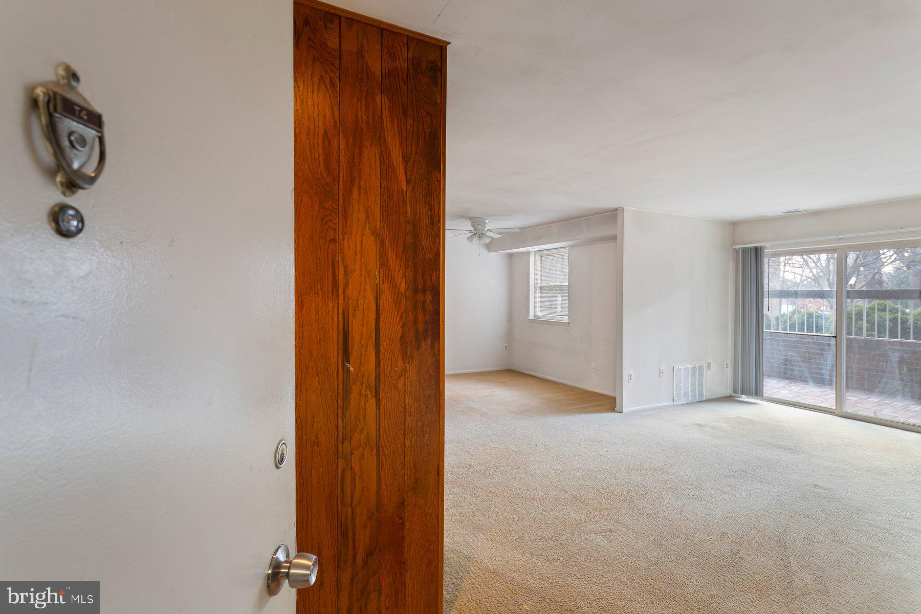 2305 Greenery Lane, Unit T43 Silver Spring, MD 20906 - Photo 2 of 30 an empty room with windows