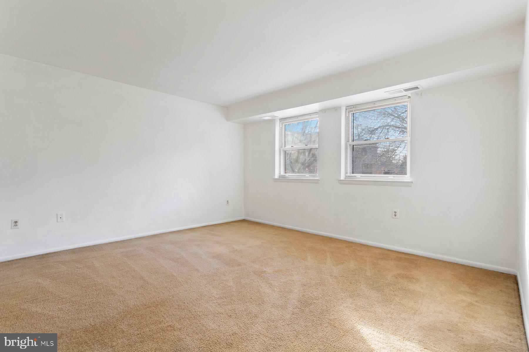 2305 Greenery Lane, Unit T43 Silver Spring, MD 20906 - Photo 21 of 30 an empty room with windows