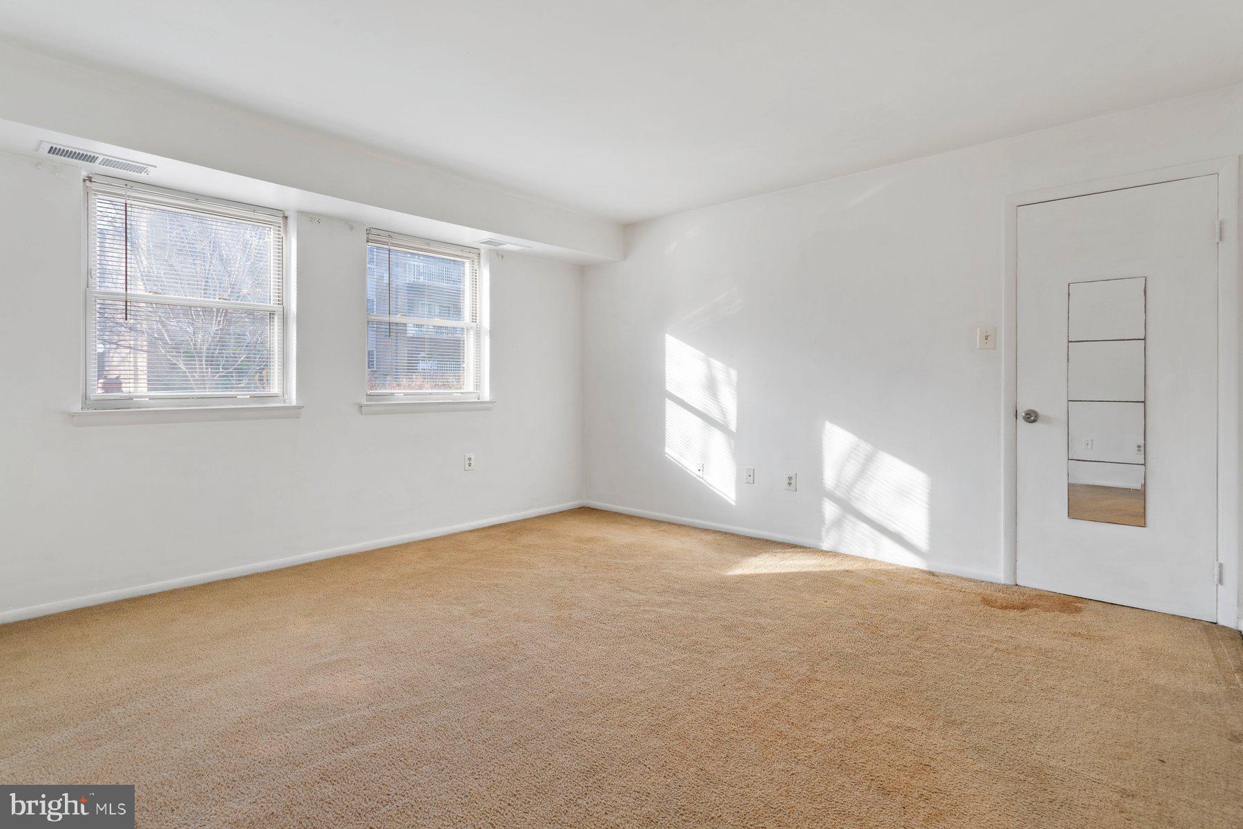 2305 Greenery Lane, Unit T43 Silver Spring, MD 20906 - Photo 22 of 30 a view of an empty room with a window