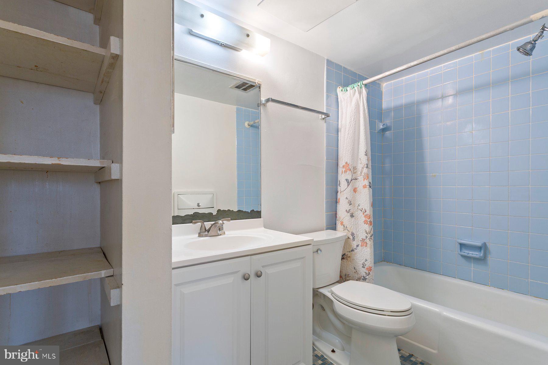 2305 Greenery Lane, Unit T43 Silver Spring, MD 20906 - Photo 25 of 30 a bathroom with a sink toilet vanity and shower