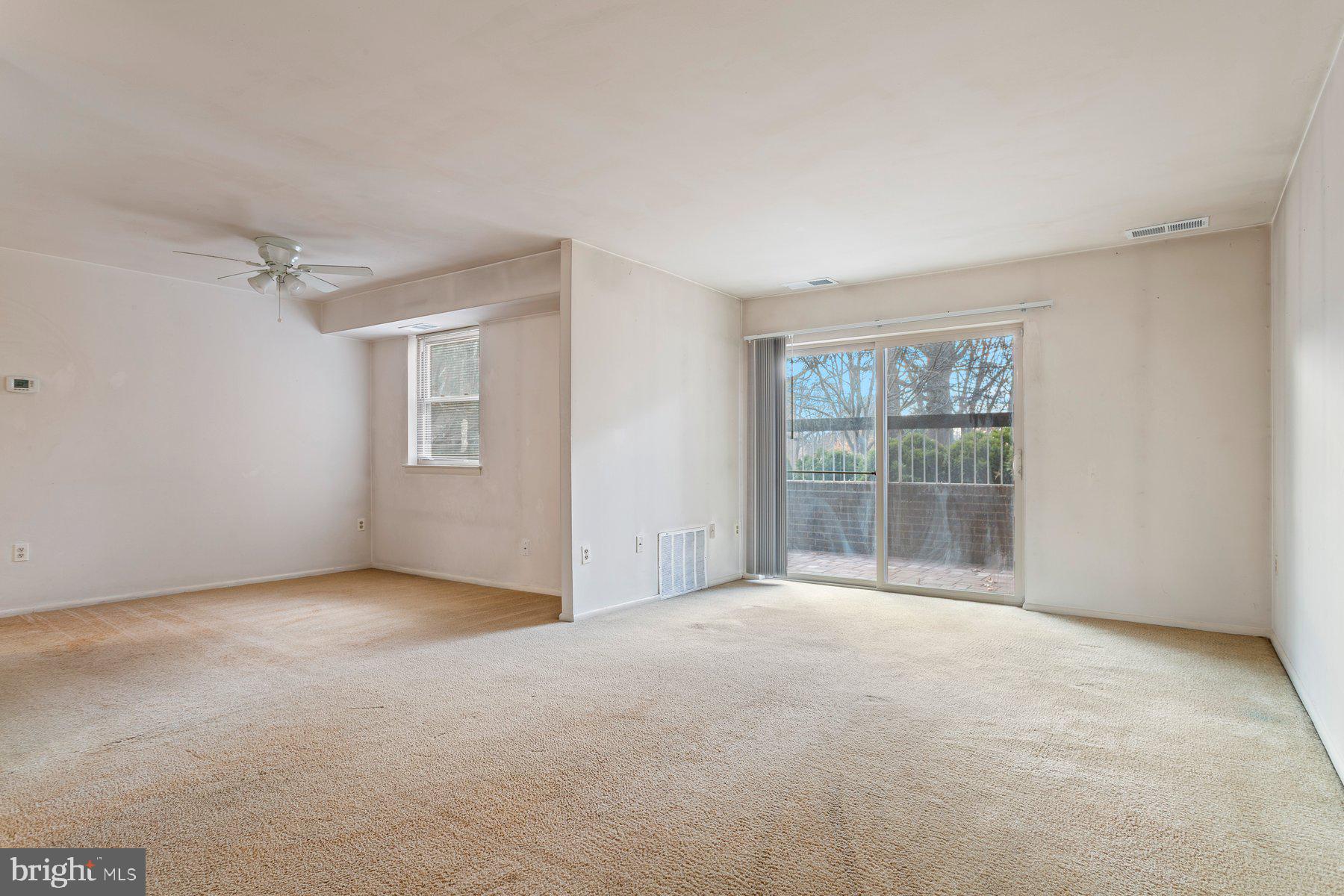 2305 Greenery Lane, Unit T43 Silver Spring, MD 20906 - Photo 3 of 30 a view of an empty room with a window