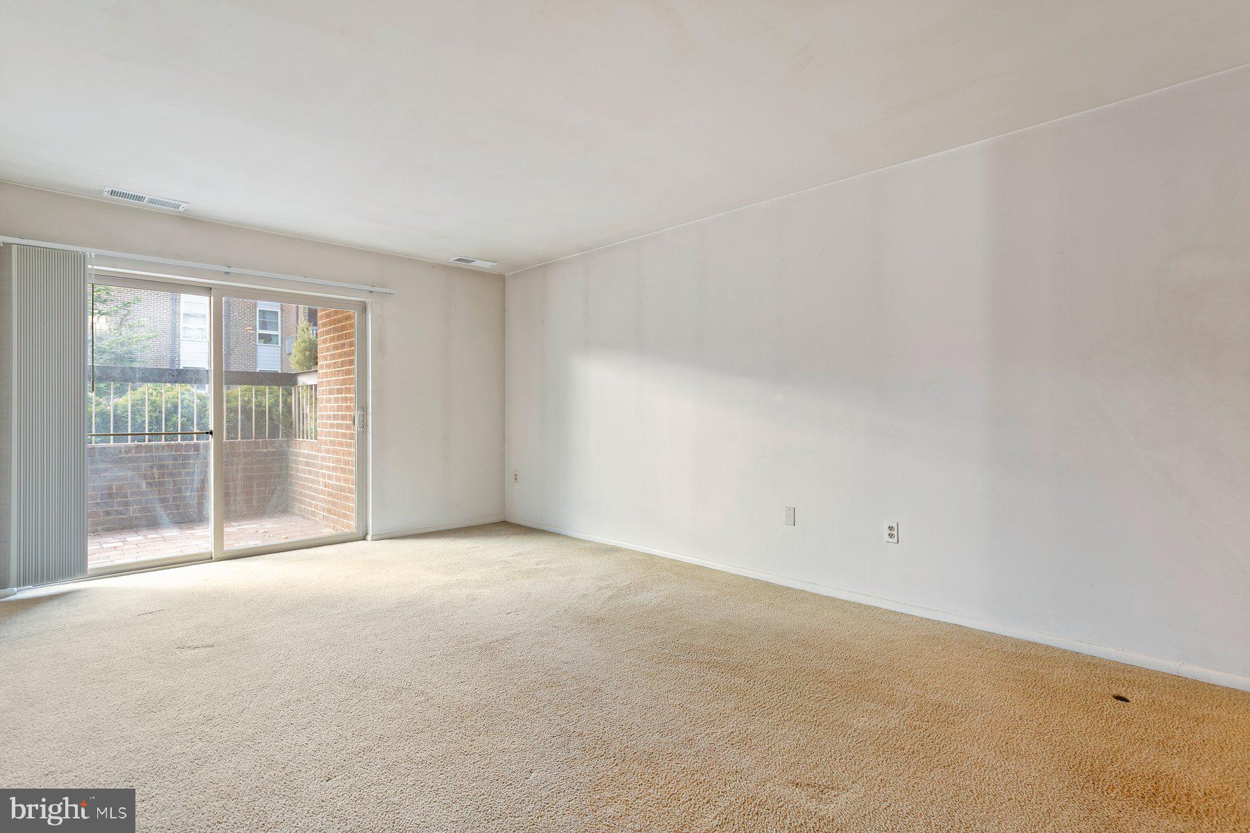 2305 Greenery Lane, Unit T43 Silver Spring, MD 20906 - Photo 6 of 30 a view of an empty room with a window