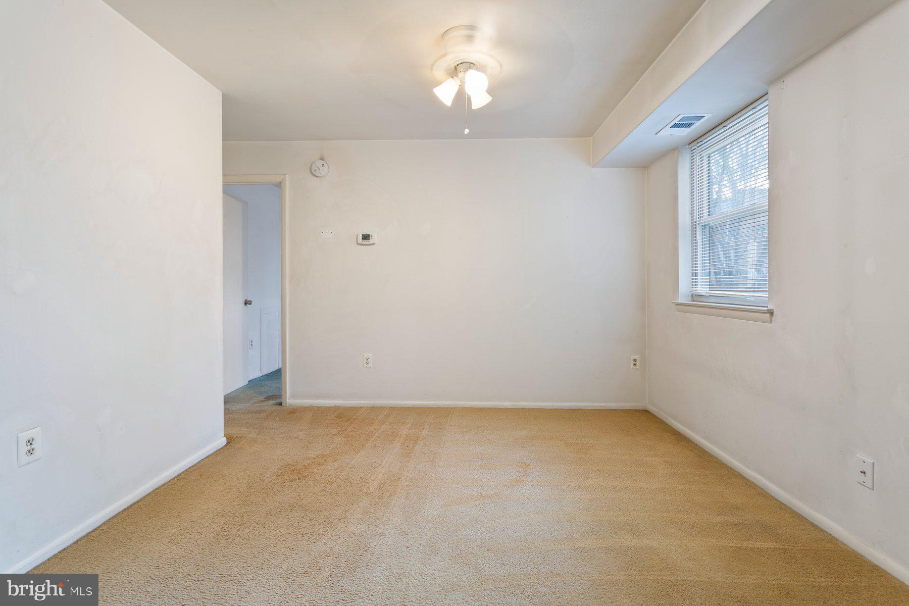 2305 Greenery Lane, Unit T43 Silver Spring, MD 20906 - Photo 10 of 30 an empty room with a empty space and windows