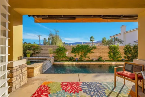 a view of a swimming pool with a lounge chairs