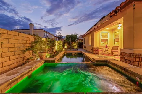 a view of a swimming pool with a patio