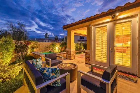 a view of a swimming pool with a yard