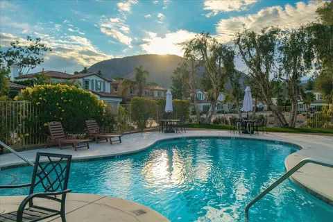 an aerial view of a house with swimming pool and outdoor space