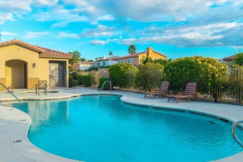 a view of a swimming pool with a chair