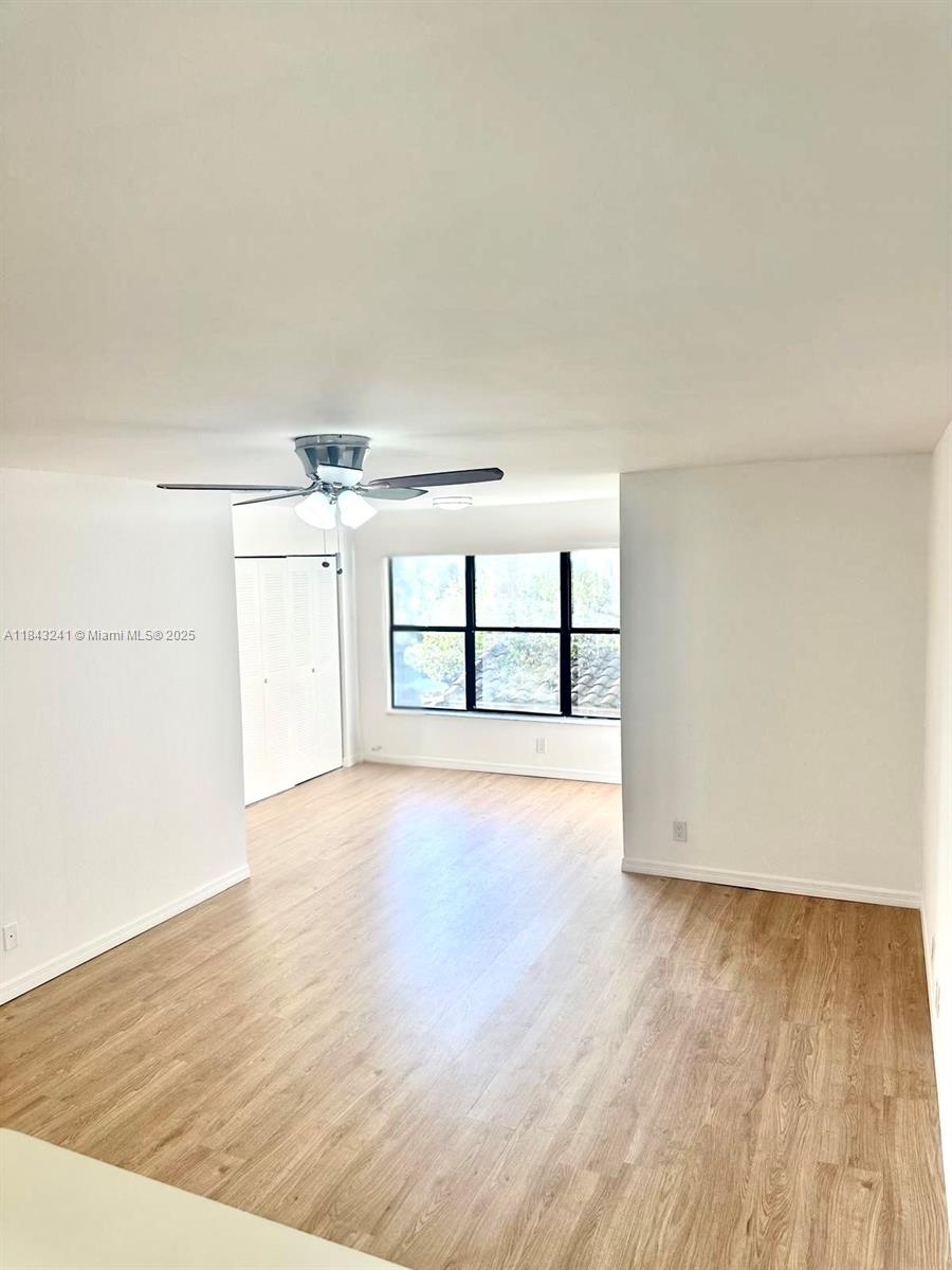 2846 South University Drive, Unit 4202 Davie, FL 33328 - Photo 13 of 17 wooden floor in an empty room