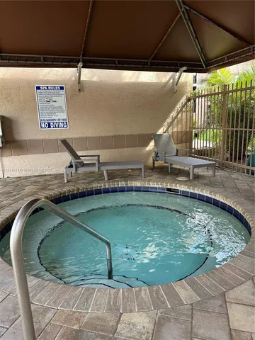 a view of a swimming pool with a chair
