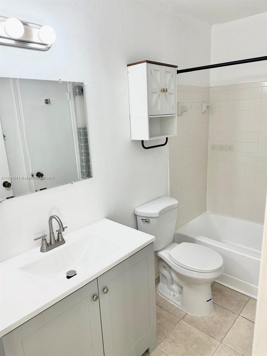 2846 South University Drive, Unit 4202 Davie, FL 33328 - Photo 10 of 17 a bathroom with a sink toilet and shower