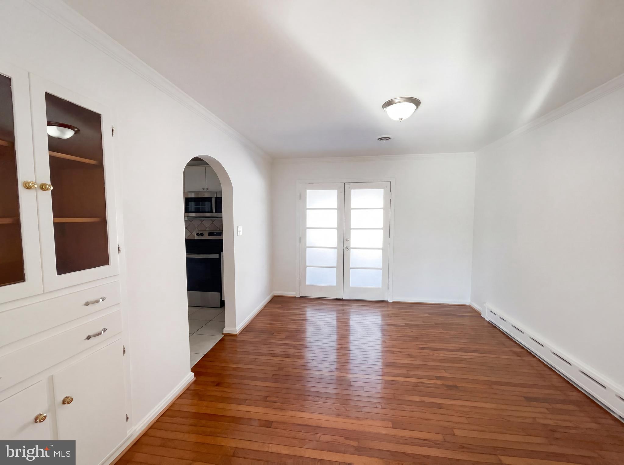 6048 Old Telegraph Road Alexandria, VA 22310 - Photo 12 of 43 wooden floor in an empty room with a window