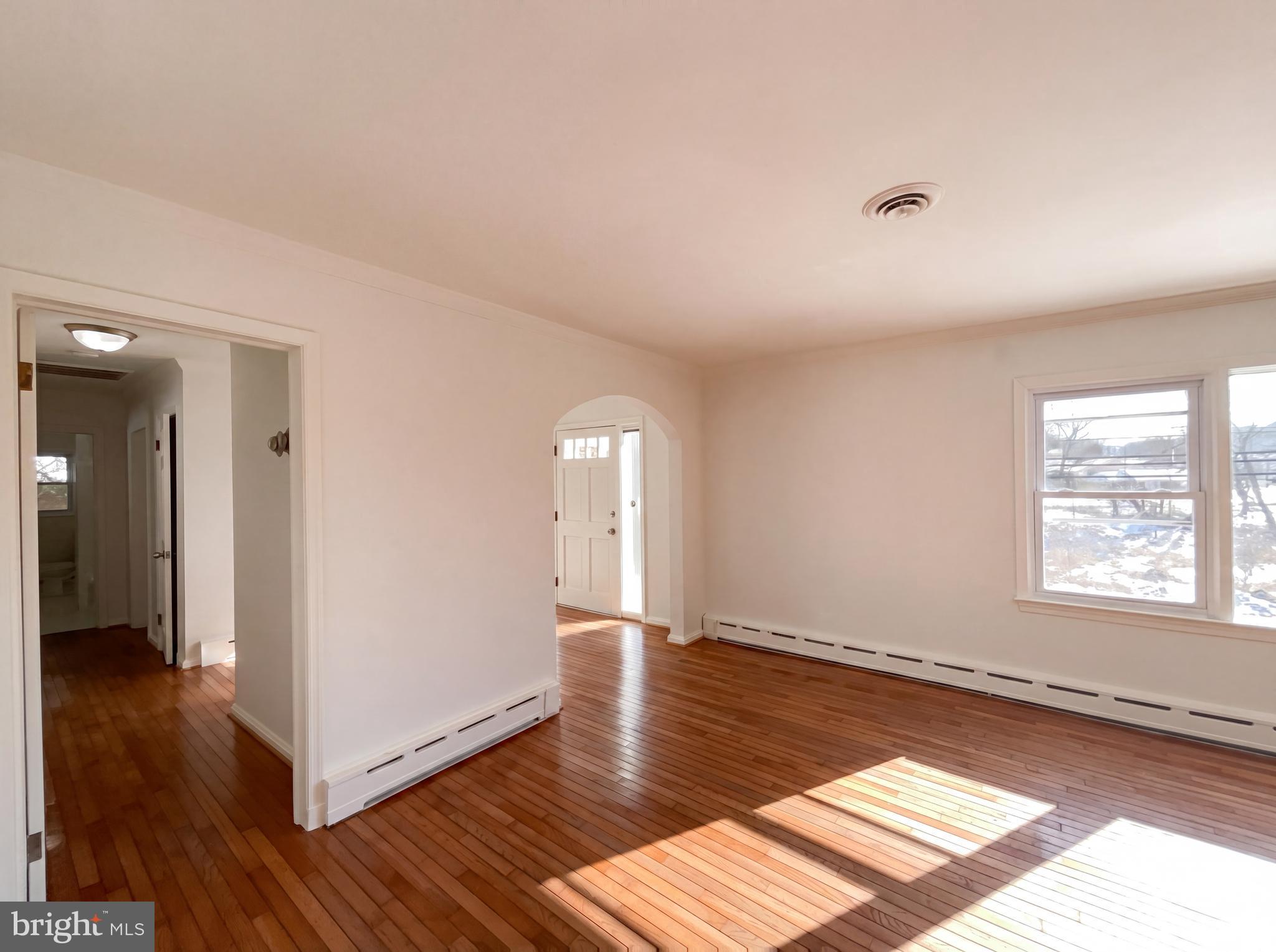 6048 Old Telegraph Road Alexandria, VA 22310 - Photo 14 of 43 a view of an empty room with wooden floor and a window
