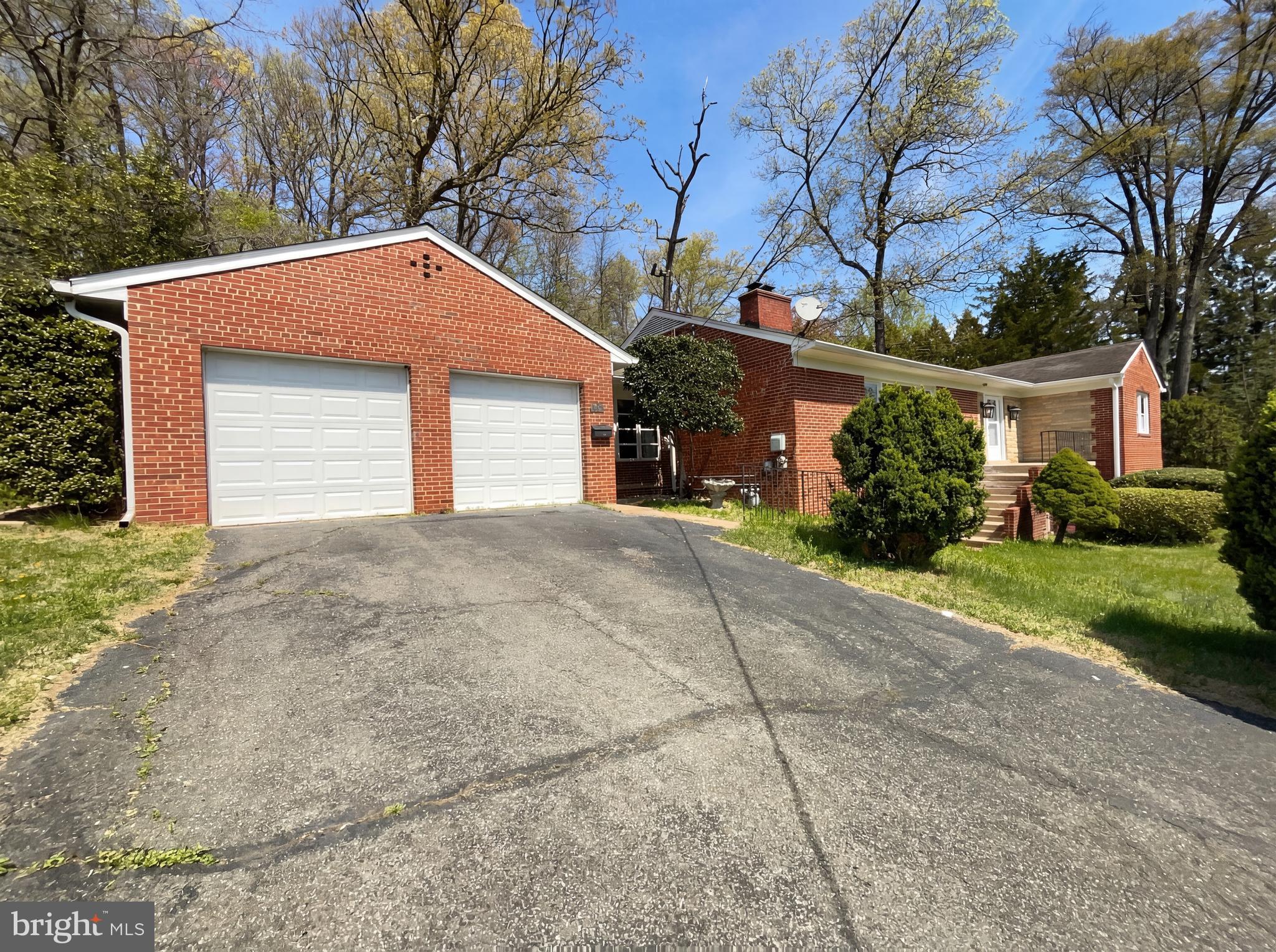 6048 Old Telegraph Road Alexandria, VA 22310 - Photo 2 of 43 a front view of house with garage and yard