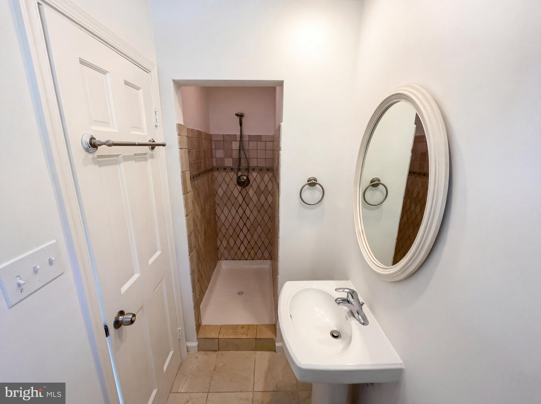 6048 Old Telegraph Road Alexandria, VA 22310 - Photo 21 of 43 a bathroom with a sink a toilet and a mirror