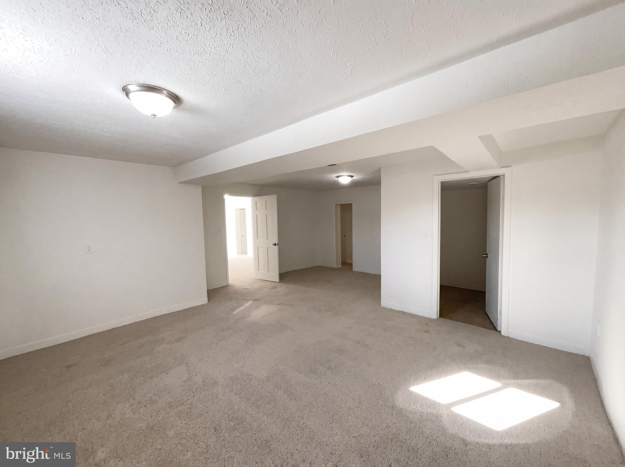 6048 Old Telegraph Road Alexandria, VA 22310 - Photo 23 of 43 a view of a big room with windows and chandelier fan