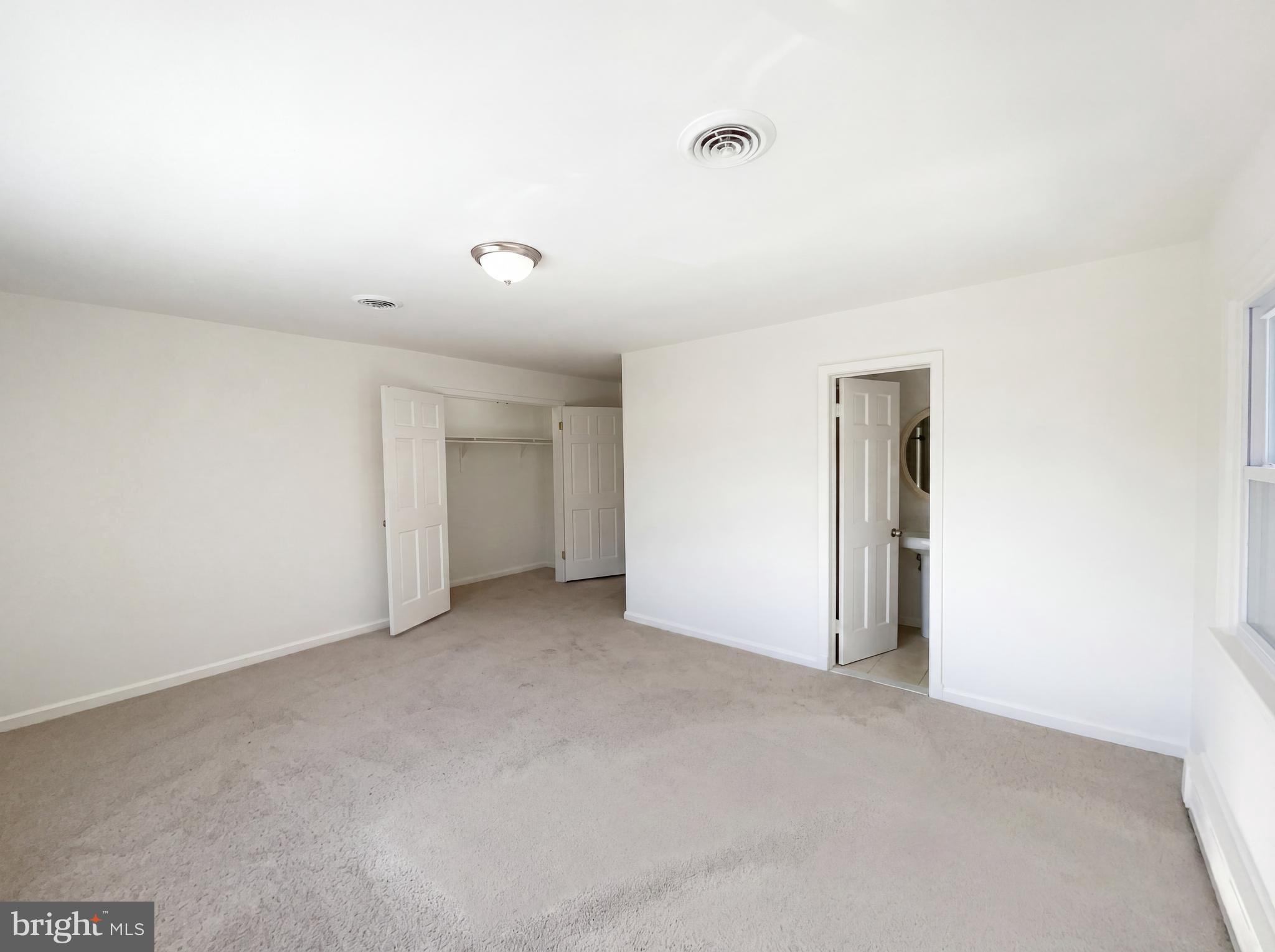 6048 Old Telegraph Road Alexandria, VA 22310 - Photo 32 of 43 an empty room with an entryway and closet
