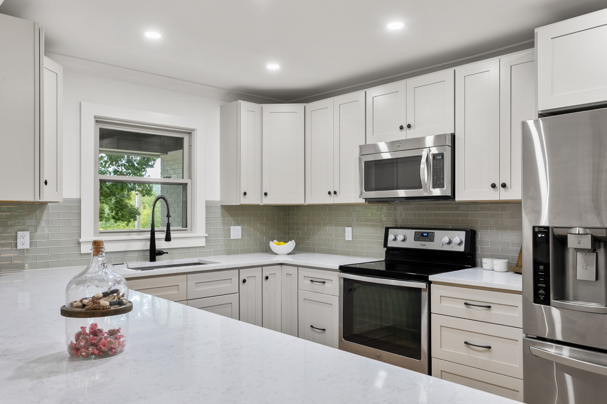 2338 North Road Murfreesboro, TN 37128 - Photo 15 of 48 a kitchen with white cabinets and appliances