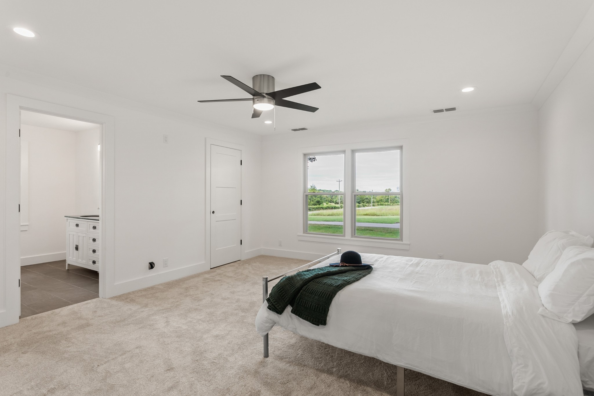 2338 North Road Murfreesboro, TN 37128 - Photo 19 of 48 a bedroom with a large bed and a ceiling fan
