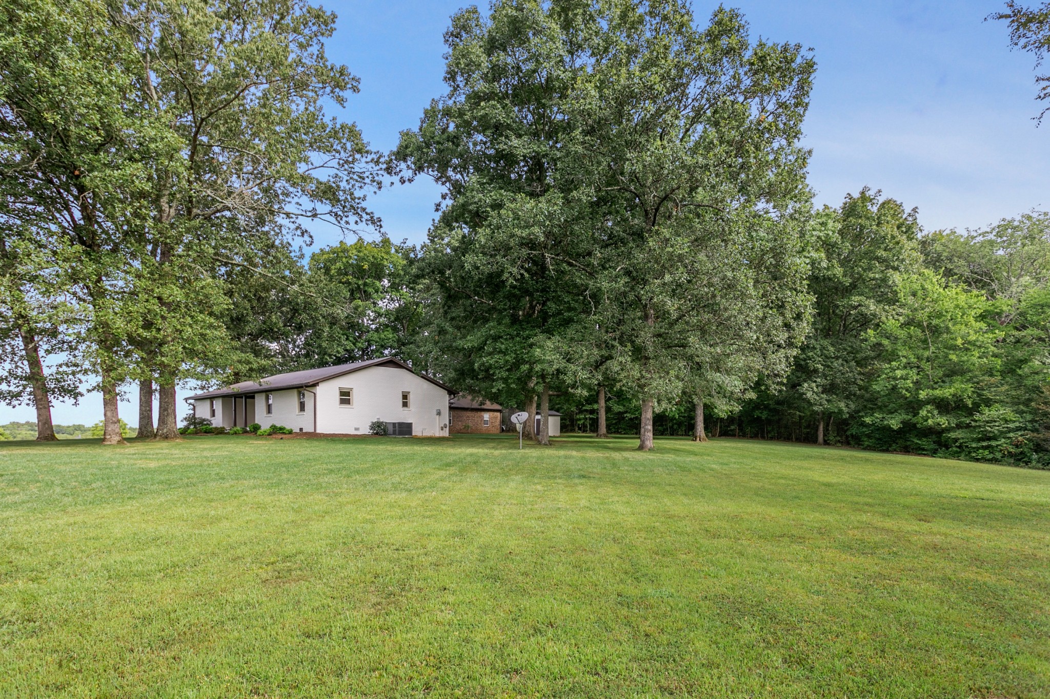 2338 North Road Murfreesboro, TN 37128 - Photo 32 of 48 a large house with a big yard and large trees