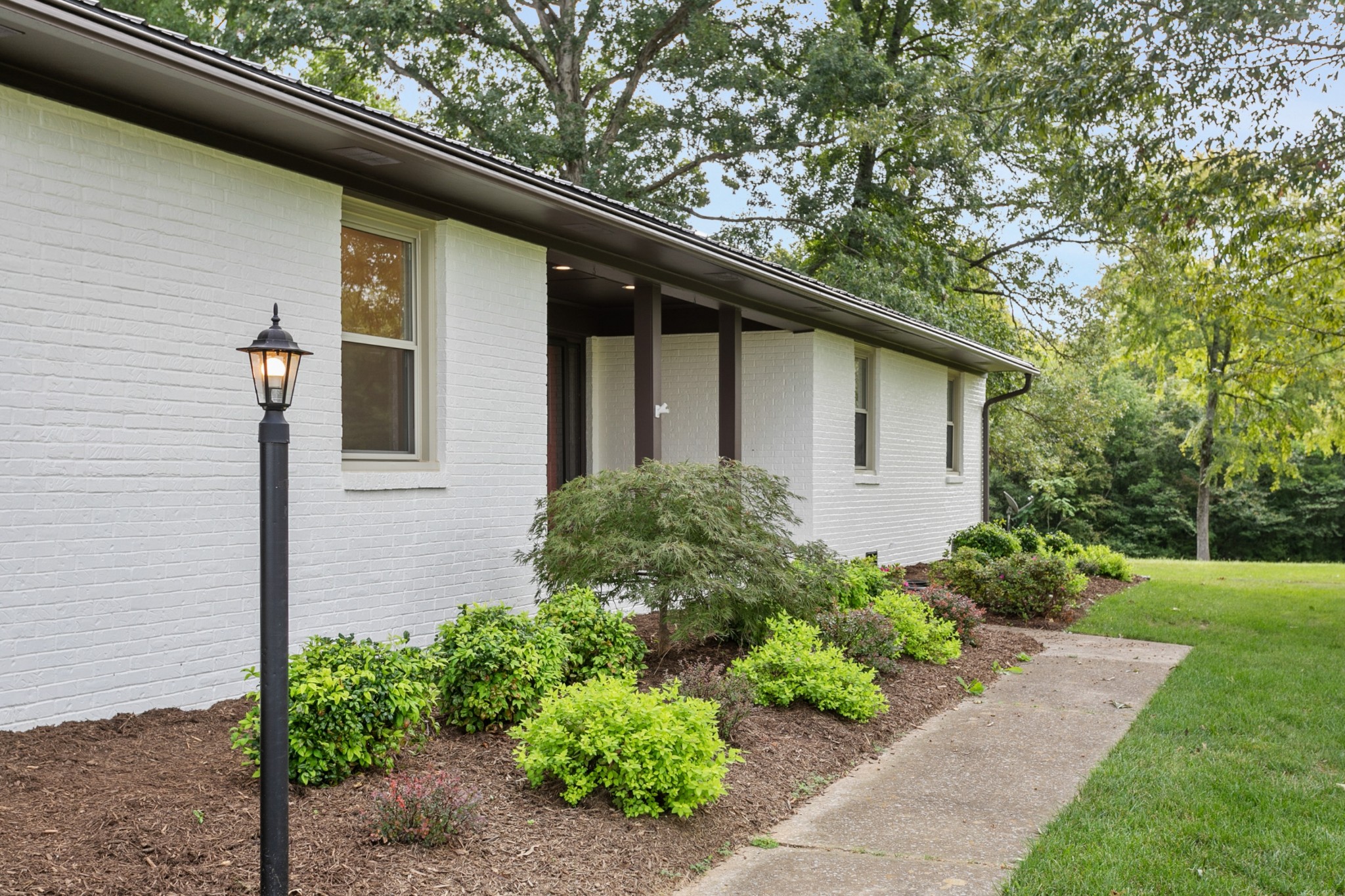 2338 North Road Murfreesboro, TN 37128 - Photo 6 of 48 a house that has a lot of plants in it