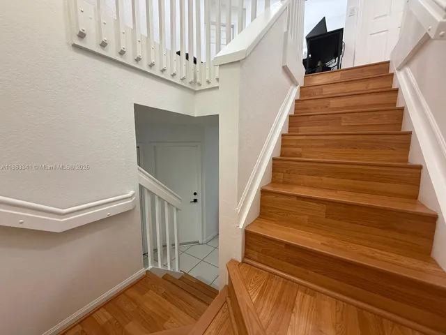 a picture of a room with furniture and air conditioner